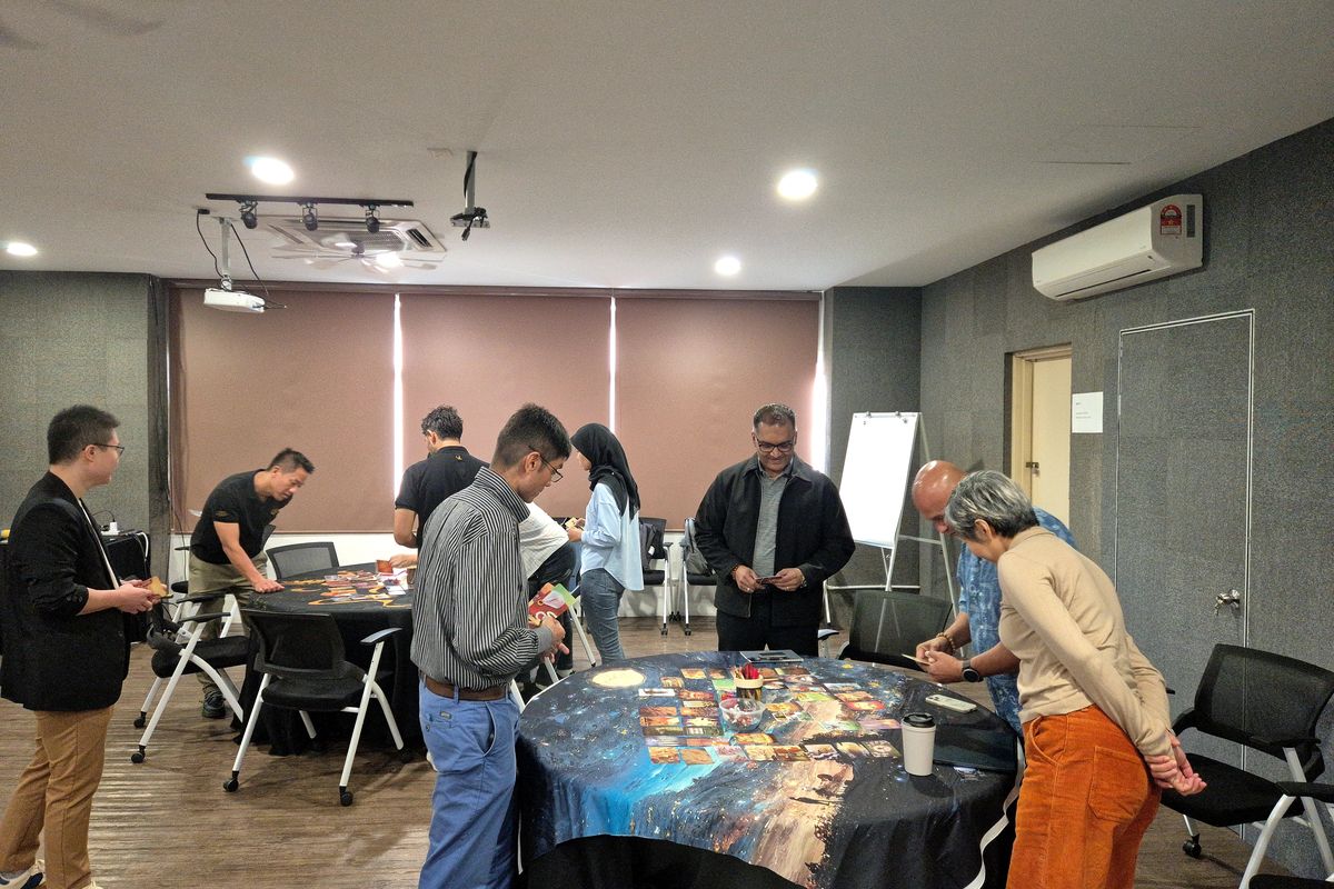 Teams working through a card activity