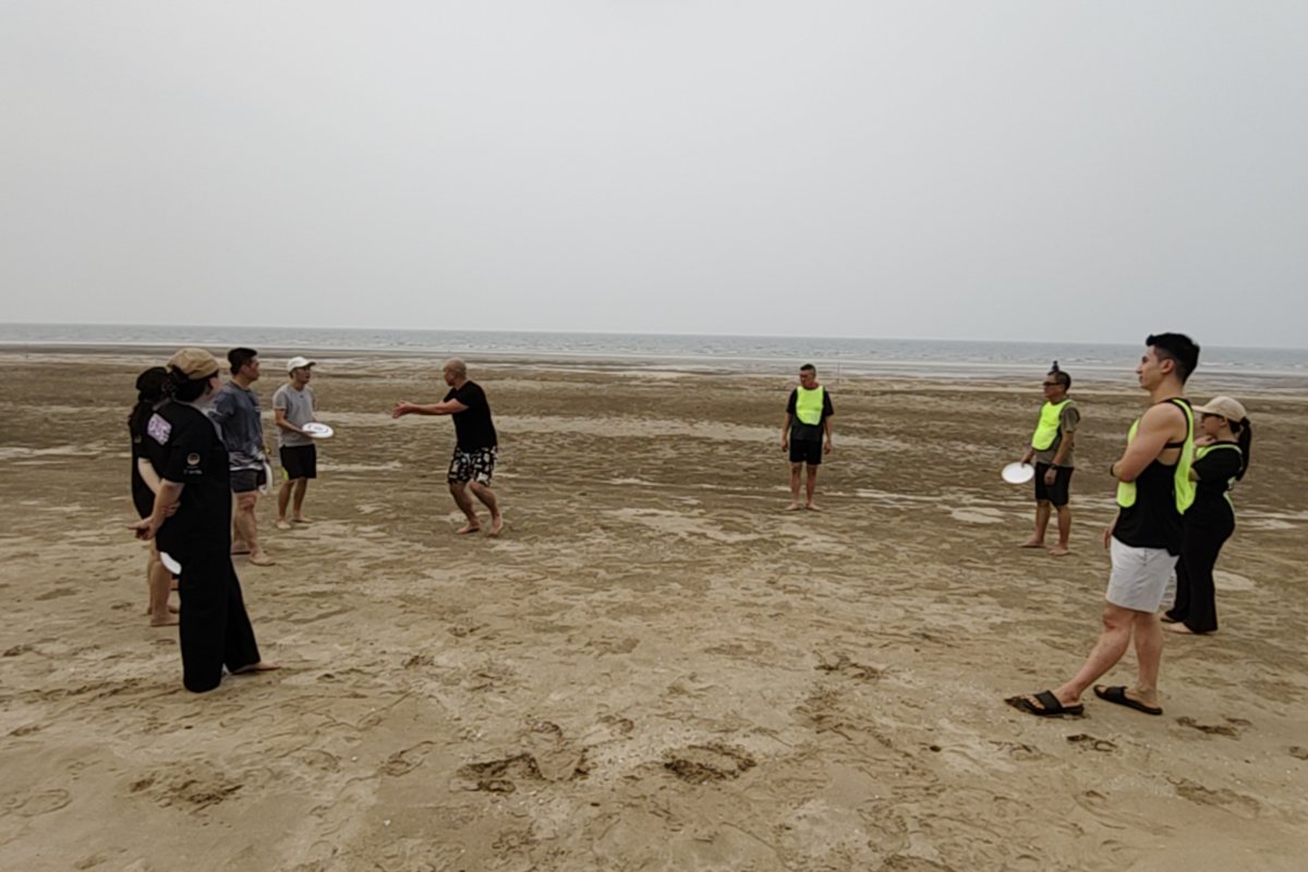 A team doing a beach activity together